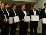 Clark County chapter of the National Football Foundation president Rick Fields poses with 2016 scholarship winners Zach Berfanger, Preston Jones, Liam Fitzgerald, Chris Mitchell, Peter Schultz-Rathbun and Will Ortner.