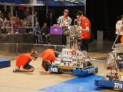 Camas: Members of Team Mean Machine race to fix their basketball-playing robot.