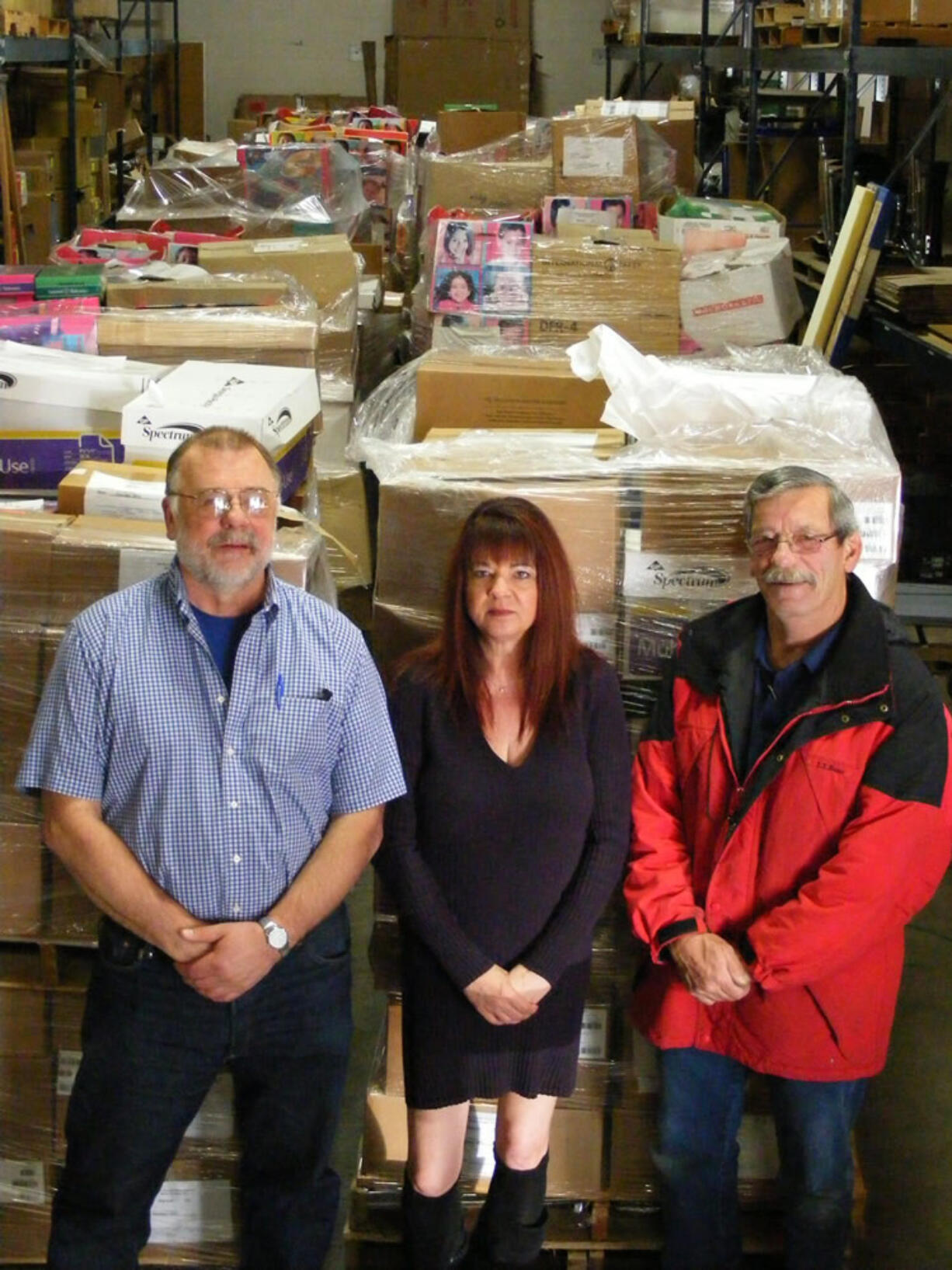 Battle Ground: Instead of recycling  them, Glenn Haag, left, Kathy Berecek and Bill Olson of the Battle Ground public schools warehouse sent 35,800 pounds of surplus math materials to needy schools in Ghana, West Africa.