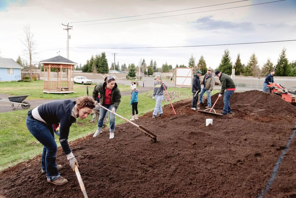 Five Corners: Local members of the Washington Association of Landscape Professionals added free finishing touches to three Habitat for Humanity homes on March 25.