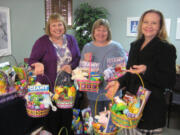 Esther Short: Volunteers Kelli Wren, Pat Clark and Childrenis Center board member Wendy Kelly assembled spring baskets which will be distributed by Childrenis Center therapists to their young clients.