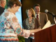 Jo Marie and Steve Hansen, right, are honored Tuesday as 2012 Philanthropists of the Year by last year's winners, Connie and Lee Kearney, left, at the Community Foundation for Southwest Washington's annual luncheon at the Hilton Vancouver Washington.