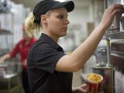 KFC employee Kristie Miles works at the fast-food restaurant in late 2011.