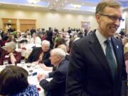 Attorney General and gubernatorial candidate Rob McKenna works the room before delivering the keynote speech at the annual Lincoln Day dinner at the Hilton Vancouver Washington on Saturday.