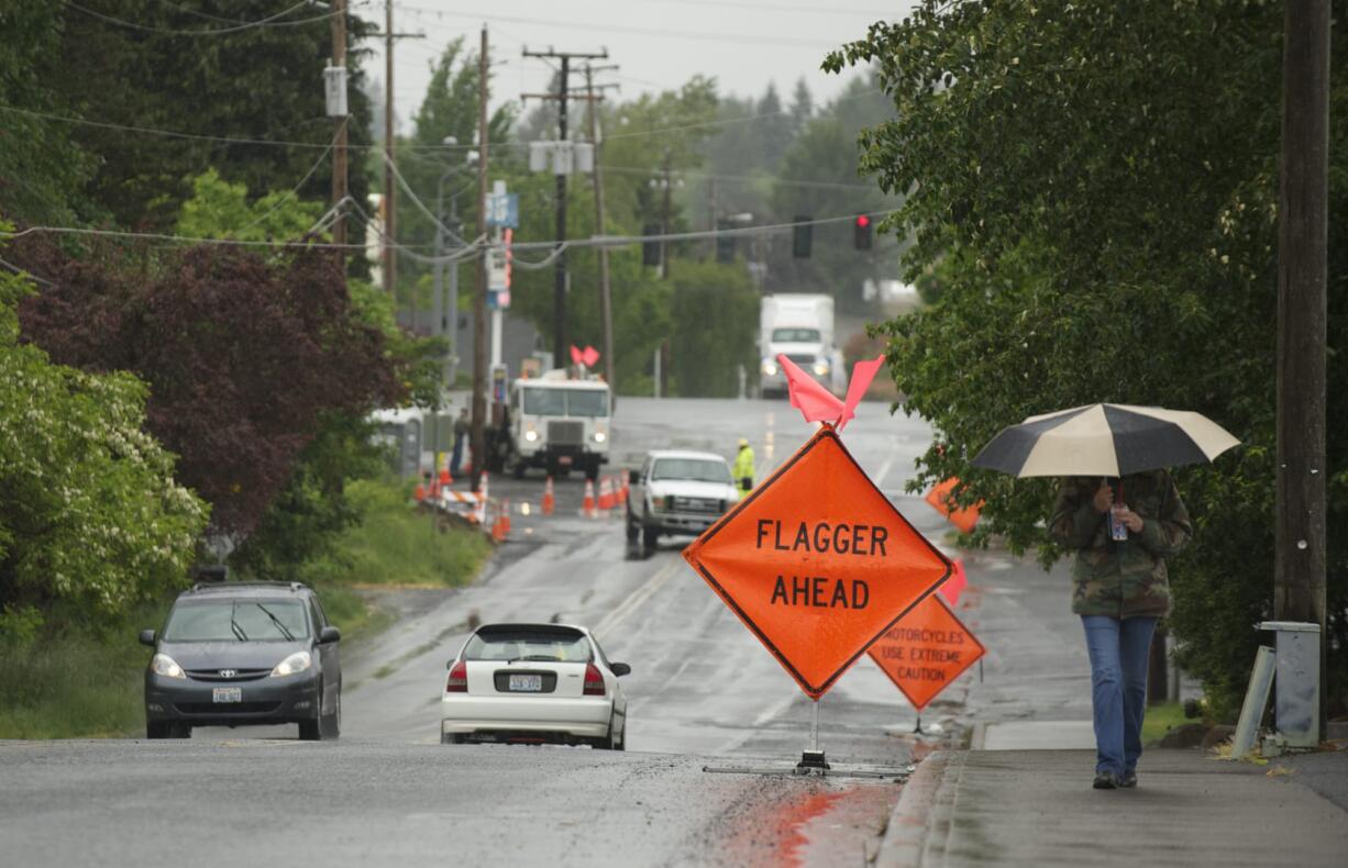 Workers from Northwest Natural Gas Co. performed preparation work May 22 for a $17.5 million enhancement of Northeast 88th Street in Hazel Dell.