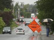 Workers from Northwest Natural Gas Co. performed preparation work May 22 for a $17.5 million enhancement of Northeast 88th Street in Hazel Dell.