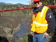 Dale Kuykendall, project manager for JR Merit, the Vancouver-based company hired to decommission Condit Dam, shows off Nov.