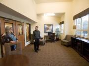 Steve Mejia, from Key Property Management, takes new tenant Deborah Brown on a tour of Vista Court apartments.