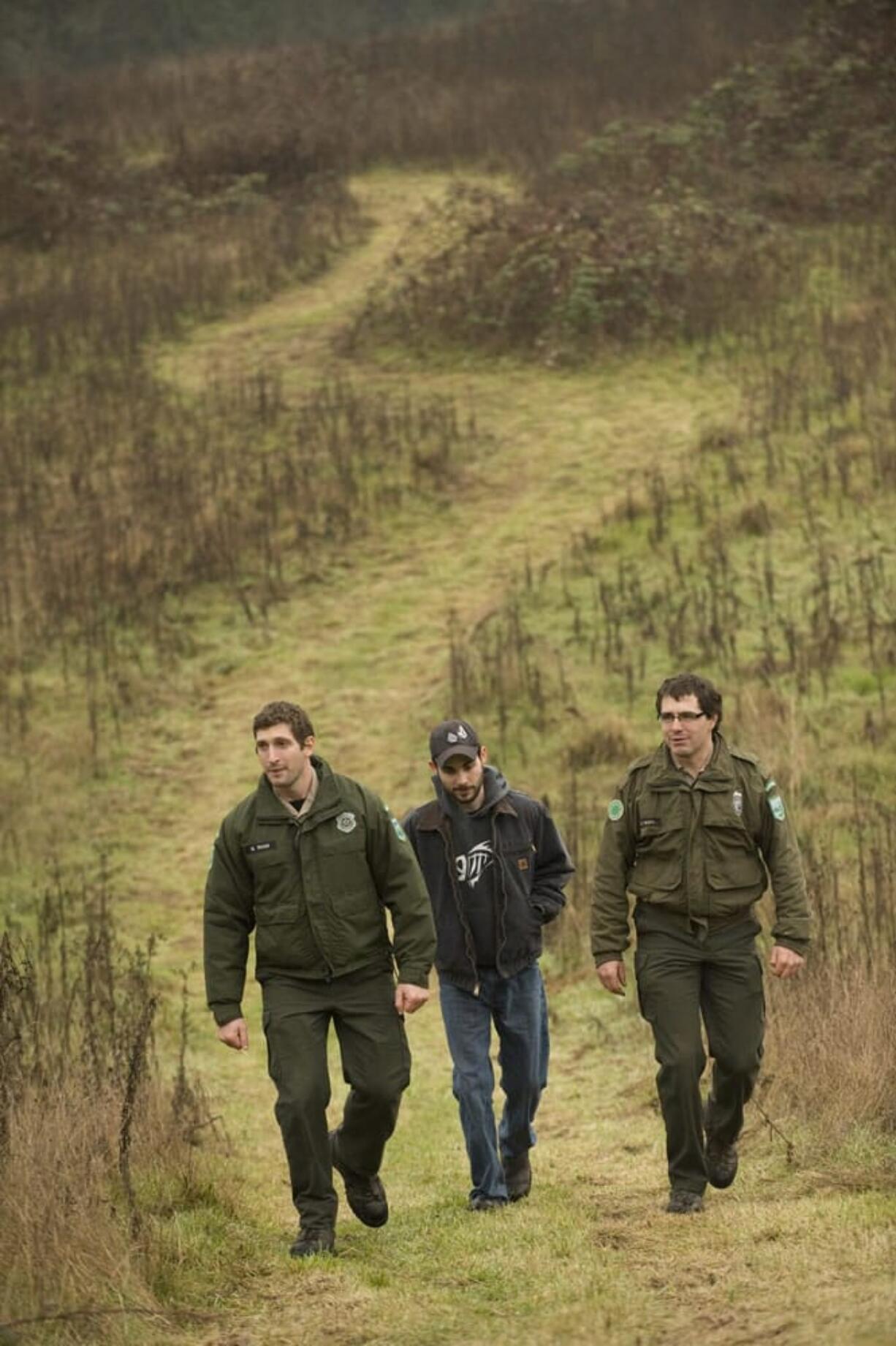 Park Ranger Mark Shaw, from left, intern Shawn Herrmann and Park Manager Matt Smith walk on a new trail at Paradise Point State Park earlier this month.