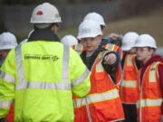 Jemtegaard Middle School sixth-grader Alex Schroeder asks engineer Lance Lehto a question about construction during Lehto&#039;s presentation on studying how soil will handle stormwater at the site of the new elementary and middle schools in Washougal.