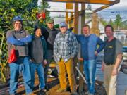 Lincoln: Volunteers -- including, from left, Arvonn Tully, David Tang, Quentin Welch, Sean Evans, Richard Rystrom and Bob Adams -- are building a community bulletin board at Latte Da Coffeehouse and Wine Bar in Vancouver.