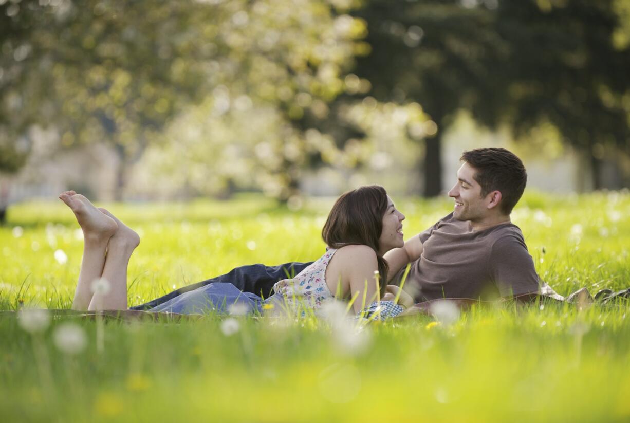 Hannah Wiggs and James Rogers of Vancouver spend quality time Sunday afternoon under their favorite tree on the Parade Grounds of the Fort Vancouver National Site. The two found the spot the day they were engaged, August 12, 2011. They will be married in little more than a month, on May 26.