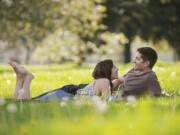 Hannah Wiggs and James Rogers of Vancouver spend quality time Sunday afternoon under their favorite tree on the Parade Grounds of the Fort Vancouver National Site. The two found the spot the day they were engaged, August 12, 2011. They will be married in little more than a month, on May 26.