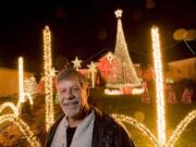 John Pfeiffer's Christmas light display at his Camas home has 55,000 lights sequenced to 17 Christmas songs.