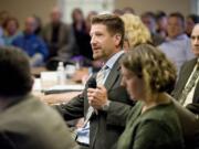 Steven Lane/The Columbian Paul Dennis, president and CEO of the Camas-Washougal Economic Development Association, speaks during a meeting of the Camas and Washougal city councils and the Port of Camas-Washougal Board of Commissioners.