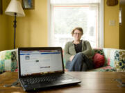 Eileen Cowen moderates her neighborhood association's Facebook page from her home in the Hough neighborhood.