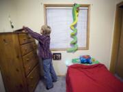 Darian Sund, 9, searches for a pencil in his bedroom so he can draw at his home in Walnut Grove.