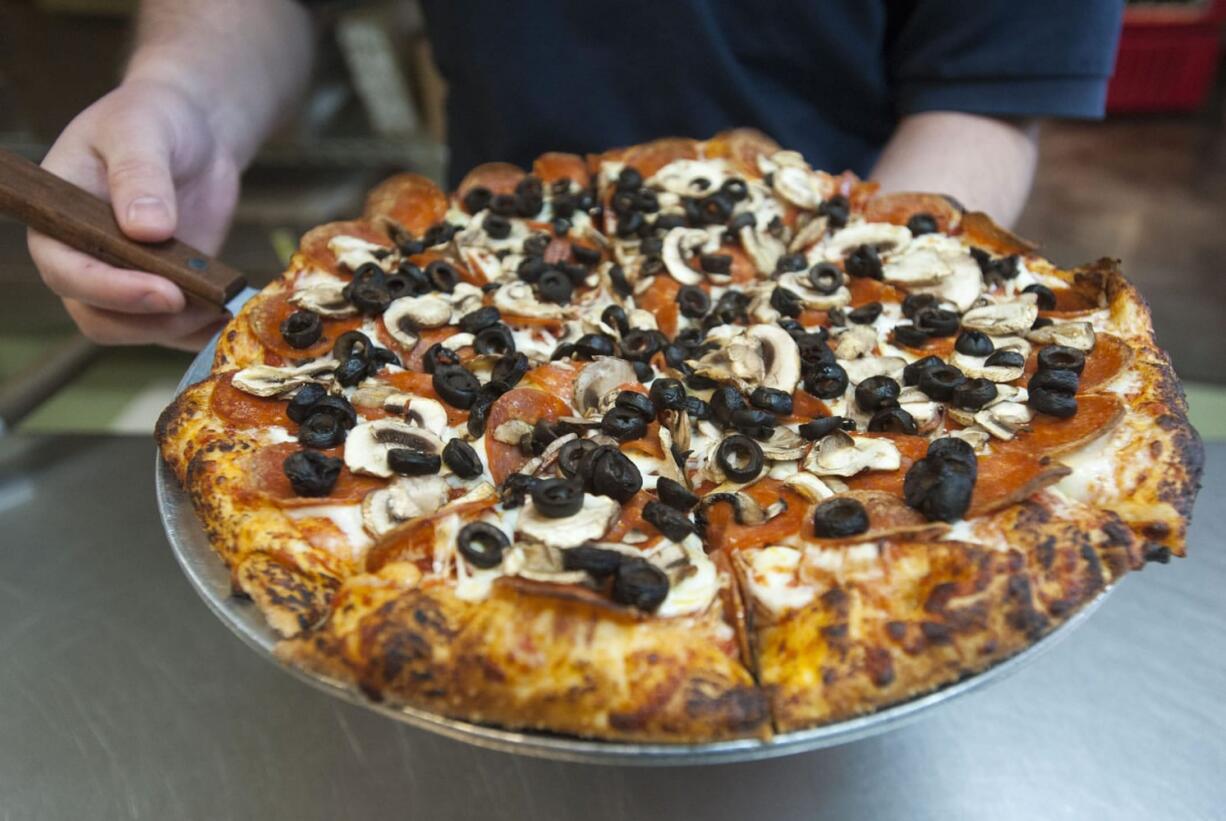 A Pepperoni Plus pizza is served Jan. 7 at Bellagios Pizza in east Vancouver.