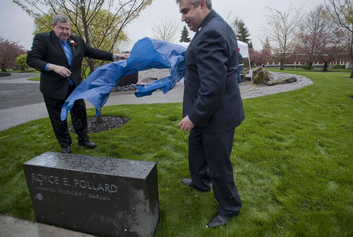 Royce Pollard and Clark College President Robert Knight unveil the marker to the Royce Pollard Japanese Friendship Garden on Thursday during the Sakura Festival at Clark.