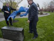 Royce Pollard and Clark College President Robert Knight unveil the marker to the Royce Pollard Japanese Friendship Garden on Thursday during the Sakura Festival at Clark.