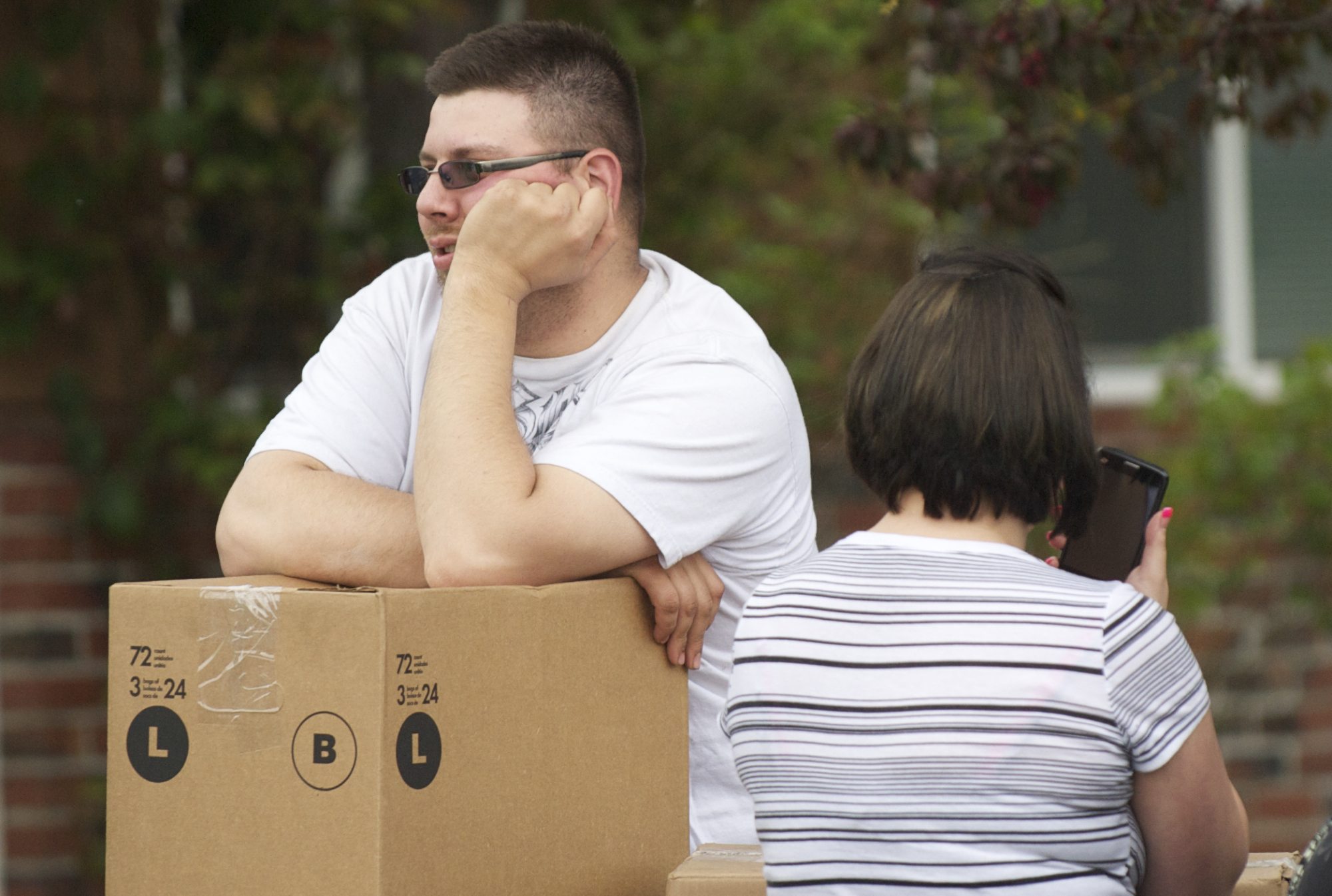 Tenant David Lee looks on after fire damaged a rental home he was in the process of moving into at 7400 NW 1st Ave.