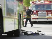 Police investigate an accident where a C-Tran bus collided  with boy on a bike at the intersection of 27th and Main in Vancouver on Saturday.