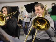 Kaleb Armstrong, 16, and Keiko Inouye, 15, play trombones in the Battle Ground High advanced jazz band.