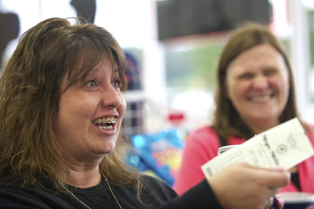 Denise Connolly, left, of Vancouver will go traveling with friend Linda Jacobs, right, if she hits Mega Millions jackpot on  Friday.