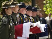 STEVEN LANE/The Columbian
Flag-bearers from a multi-agency honor guard wait to raise the flag to half-staff during the annual Clark County Law Enforcement Memorial Ceremony on Thursday at the Clark County Public Service Center.