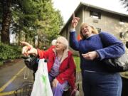 Pat Norby, right, and her mother, Jerry Sanford, 91, feed squirrels in a garden at Van Mall assisted living in Vancouver.