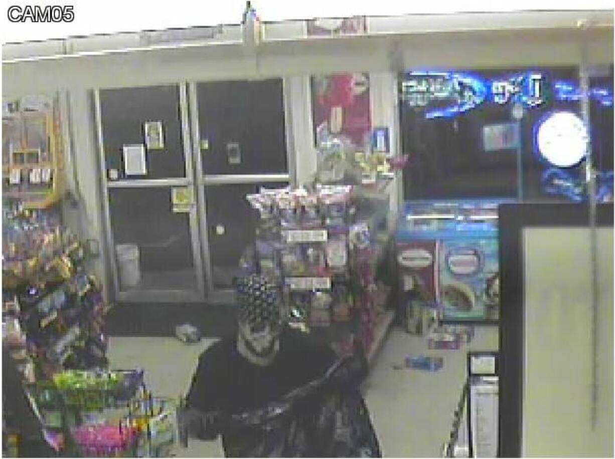 Battle Ground Police Department
Security video shows a man robbing the IQ Minit Mart in Battle Ground.