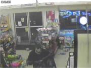 Battle Ground Police Department
Security video shows a man robbing the IQ Minit Mart in Battle Ground.