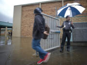 District Resource Officer Donald &quot;Raven&quot; Hubbard gets ready to lock an exterior gate at McLoughlin Middle School.