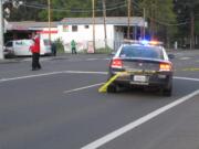 Vancouver police investigate a fatal hit-and-run crash Thursday near the intersection of Fourth Plain Boulevard and Neals Lane in Vancouver.