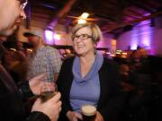 State Rep. Sharon Wylie celebrates election day results with Vancouver City Councilman Jack Burkman, left, at her party at the Atrium Lounge Tuesday.