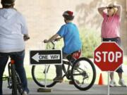 Stephanie Vanveen, a physical education teacher at Wy'east Middle School, reacts as Jordan Hornbeck, 13, fails to yield and signal during a bicycle safety class at the school Thursday. The class was part of a two-week unit teaching middle-schoolers hand signals, the rules of the road and bicycle safety.