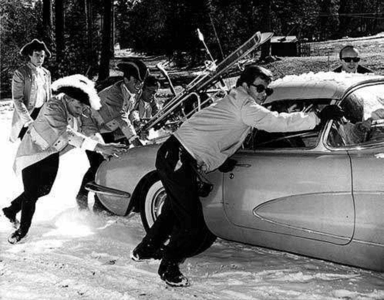 Roger Hart, upper right, and Paul Revere &amp; the Raiders help Dick Clark push his Corvette on a snowy road at California's Big Bear ski resort in 1965, during filming of &quot;Where the Action Is.&quot;