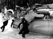 Roger Hart, upper right, and Paul Revere &amp; the Raiders help Dick Clark push his Corvette on a snowy road at California's Big Bear ski resort in 1965, during filming of &quot;Where the Action Is.&quot;