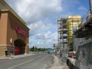 An older Target store at the Jantzen Beach Center mall, at left, will be replaced by a larger store now under construction, right, and expected to open in October with fresh groceries, such as wrapped meat and produce.