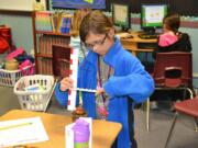 Ridgefield: Emma Smithline measures her paperwhite bulb during a science project at Union Ridge Elementary School in Ridgefield.