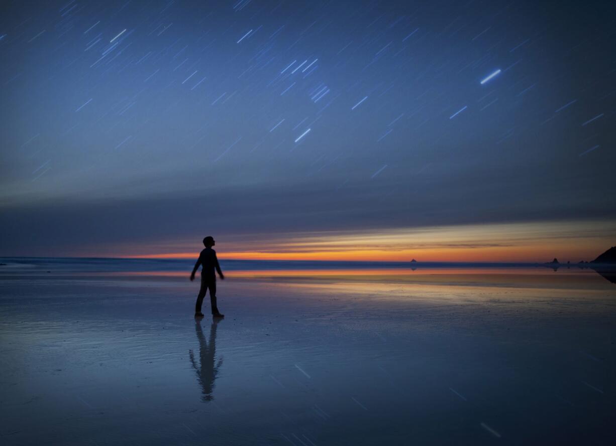 &quot;Midnight Light&quot; by Lijah Hanley came in second place in the National Geographic Student Expedition Contest. It's a dual exposure self-portrait. He shot one 10-minute exposure of the beach and a second 30-second exposure of himself for the image.