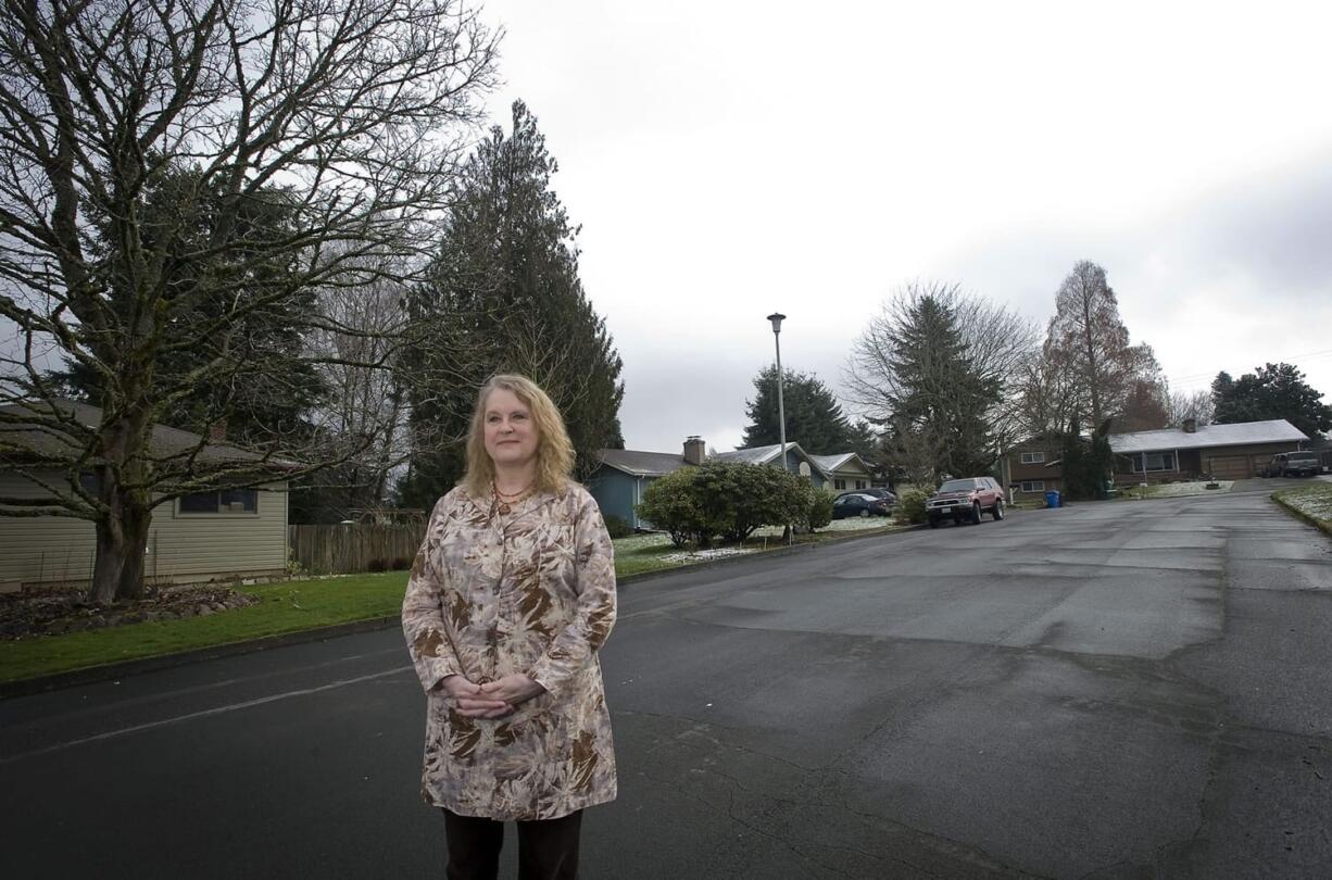 Ila Stanek, president of the West Hazel Dell Neighborhood Association, stands March 1 near a state-funded home for teen boys who are unable, for whatever reason, to be placed in foster homes.