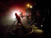 Firefighters respond to an attic fire inside a home on N.W. 45th Street near Franklin Street on Sept.