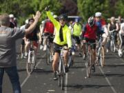 Photos by STEVEN LANE/The Columbian 
 Supporters follow Lori Salierno as she starts her 3,000 mile bicycle journey to Georgia on Sunday at Mountain View High School in Vancouver. She is raising money for her organization, Celebrate Life International, which helps at-risk students.