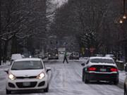 Motorists and pedestrians alike dealt with icy downtown roads, such as West Eighth Street in downtown Vancouver, on Monday morning. Roads could be icy in some spots Tuesday morning, forecasters say, but temperatures will warm later in the day.