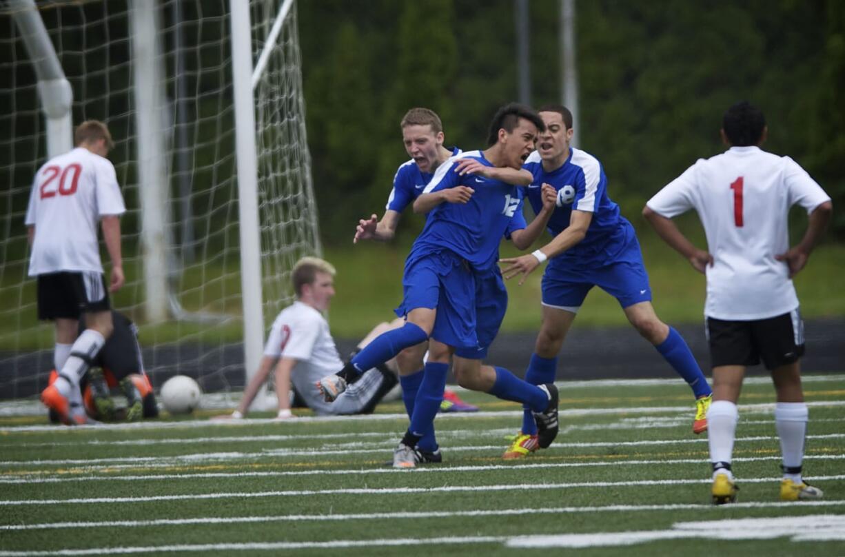 Mountain View's Ngawang Choephel celebrates with teammates after scoring the Thunder's go-ahead goal in their Class 3A state semifinal win over Camas.