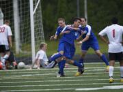 Mountain View's Ngawang Choephel celebrates with teammates after scoring the Thunder's go-ahead goal in their Class 3A state semifinal win over Camas.