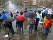 People rally in Vancouver against a state rule on restrooms.