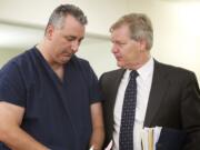 Steven P. Hyson, left, speaks with his attorney, Thomas Phelan, Friday May 4, 2012 at arraignment court in Vancouver, Washington. Hyson is accused of assaulting his 22-year-old stepson on Tuesday, according to a news release from the Clackamas County, Ore. sheriffis office.