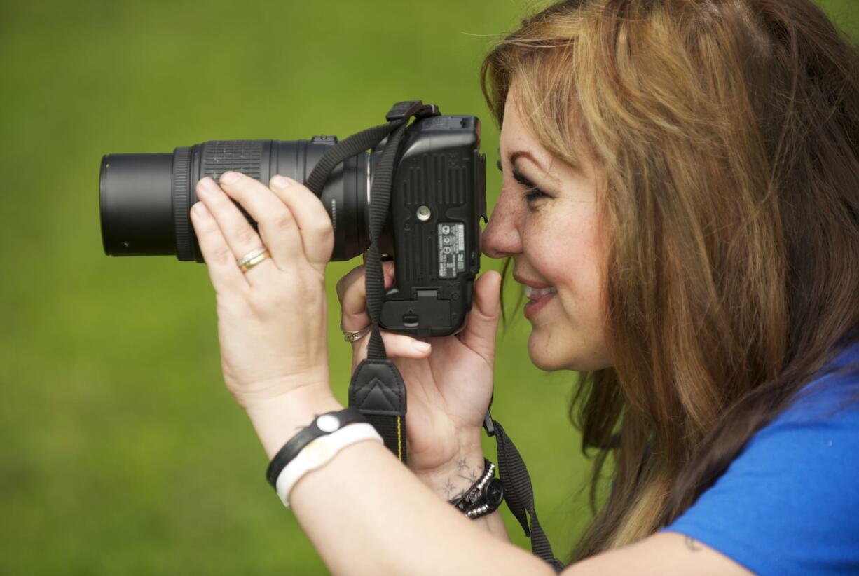 Battle Ground photographer Korie Accetta photographs a subject at Hockinson Meadows Park on April 21.